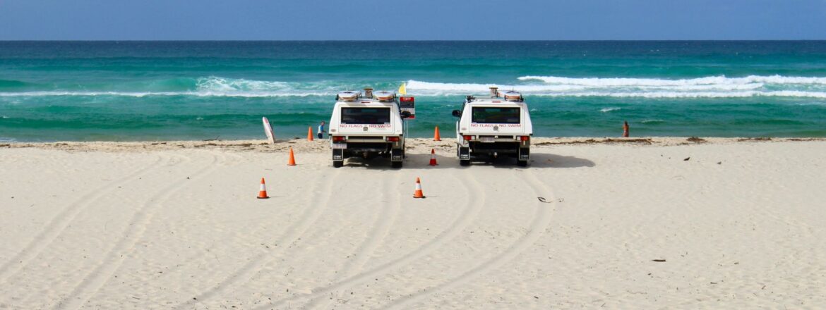 Two cars in the sea shore with the view of the beatiful Palm Beach