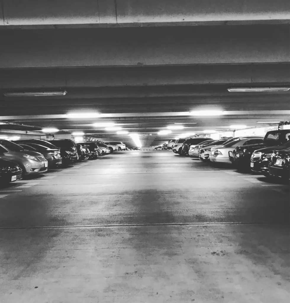 Black and white photo of an underground car park