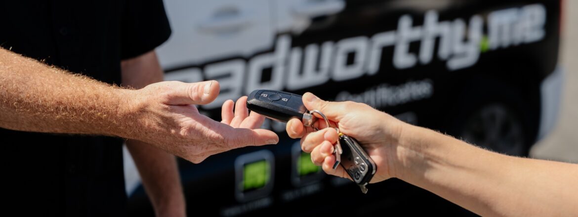 Car keys handed over after a QLD safety certificate inspection for a vehicle sale