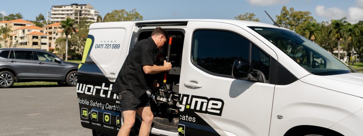 Roadworthy.me inspector unloading a trolley jack from the van for an at-home QLD safety certificate