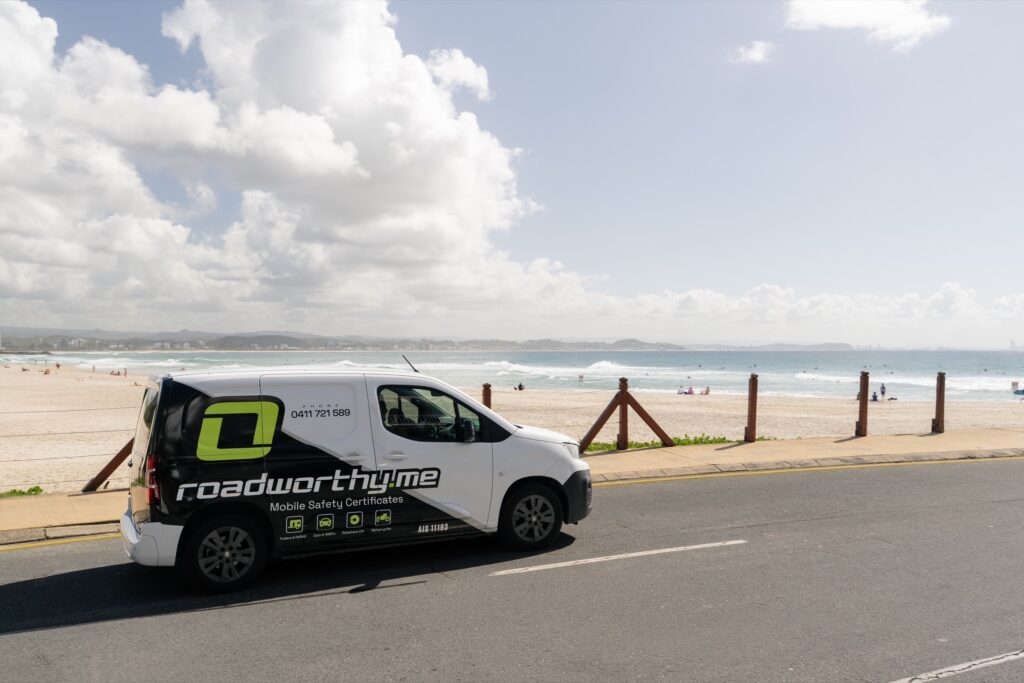 Roadworthy.me mobile inspection van driving along the Gold Coast beachfront