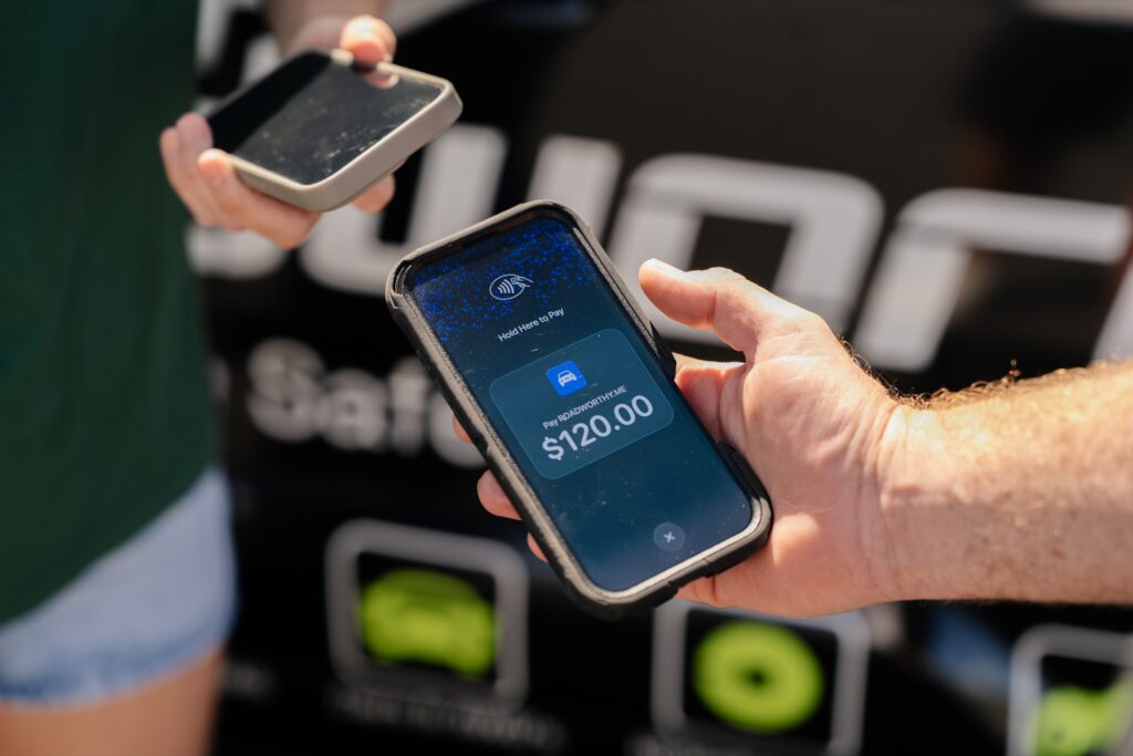 Customer paying $120 by phone for a mobile safety certificate inspection on the Gold Coast