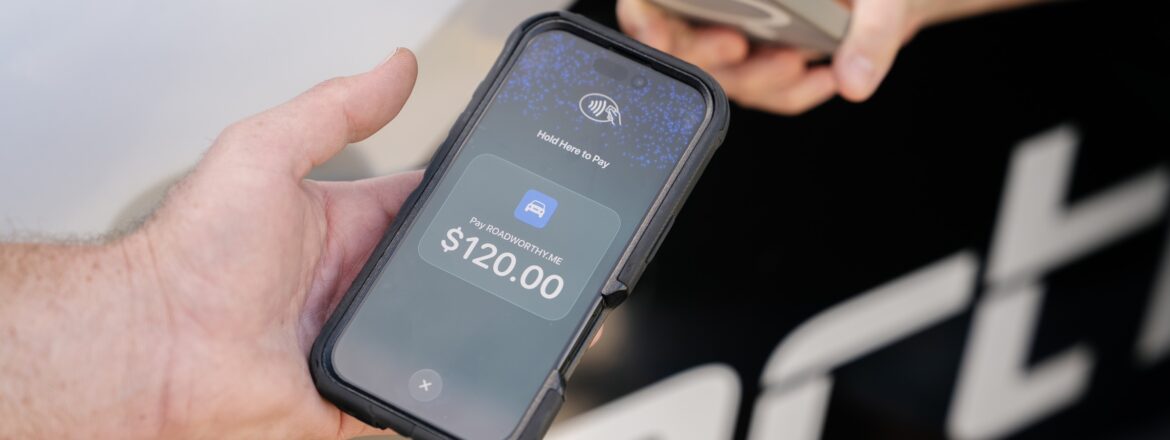 Customer paying by tap-to-pay for a same-day Gold Coast safety certificate inspection