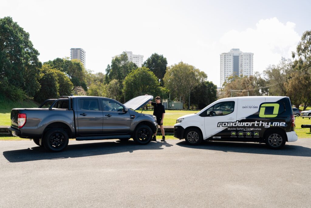 Ute with the bonnet up beside the Roadworthy.me van – mobile safety certificate in Tallebudgera