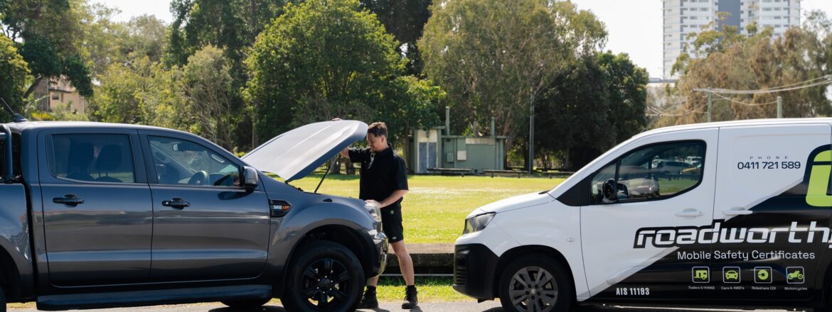 Ute with the bonnet up beside the Roadworthy.me van during a QLD safety certificate inspection
