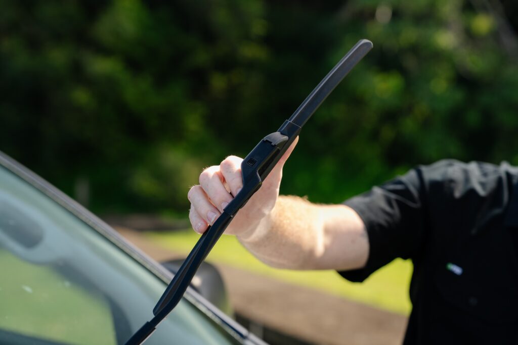 Close-up of a windscreen wiper blade being checked before a QLD safety certificate